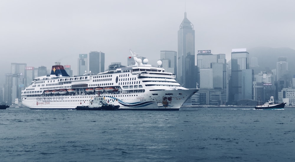 white cruise ship near city during day