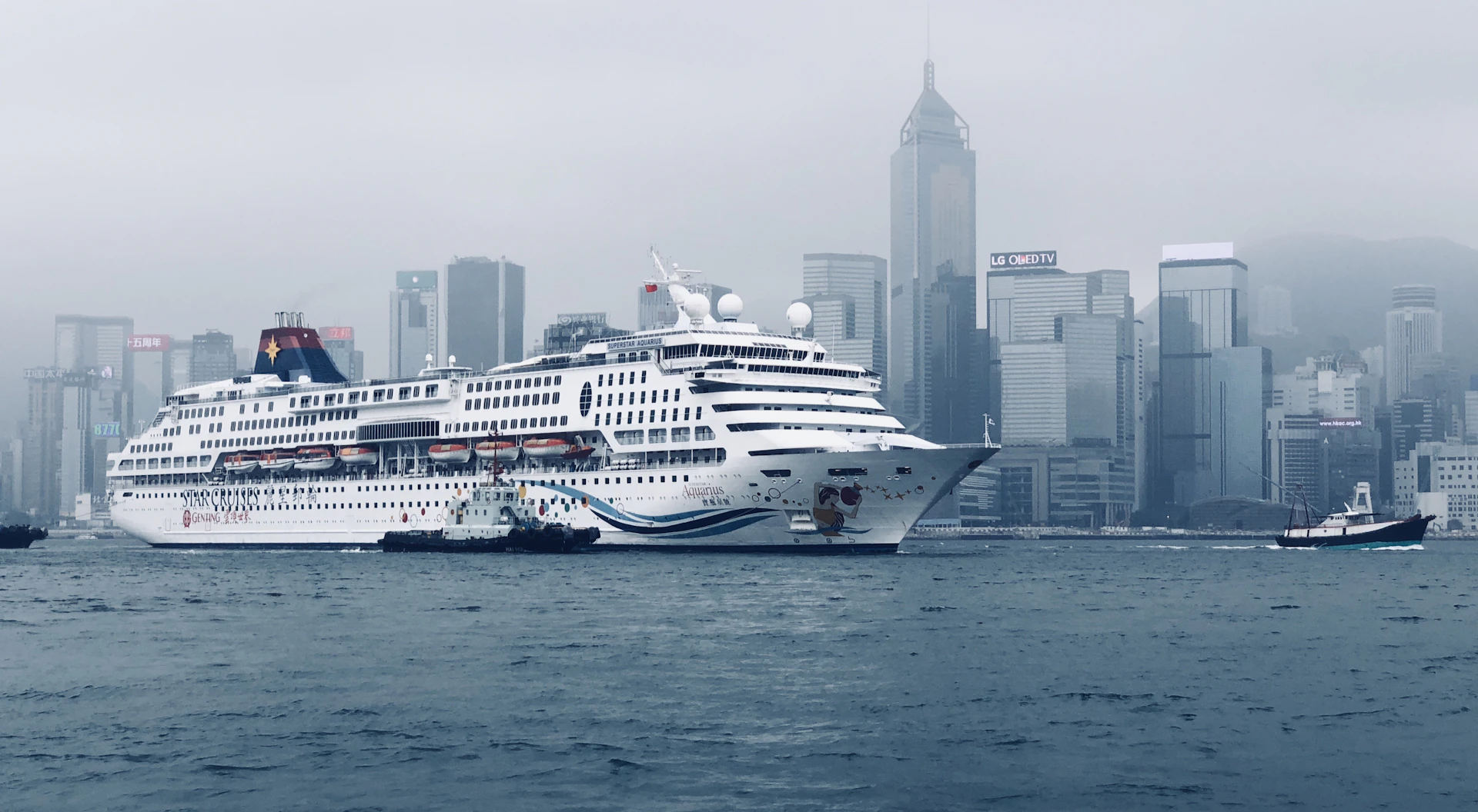 white cruise ship near city during day