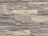 An arrangement of rectangular stones laid out in layers, forming a textured wall pattern. The stones vary in size and exhibit a rugged, rough appearance with natural lines and grooves.