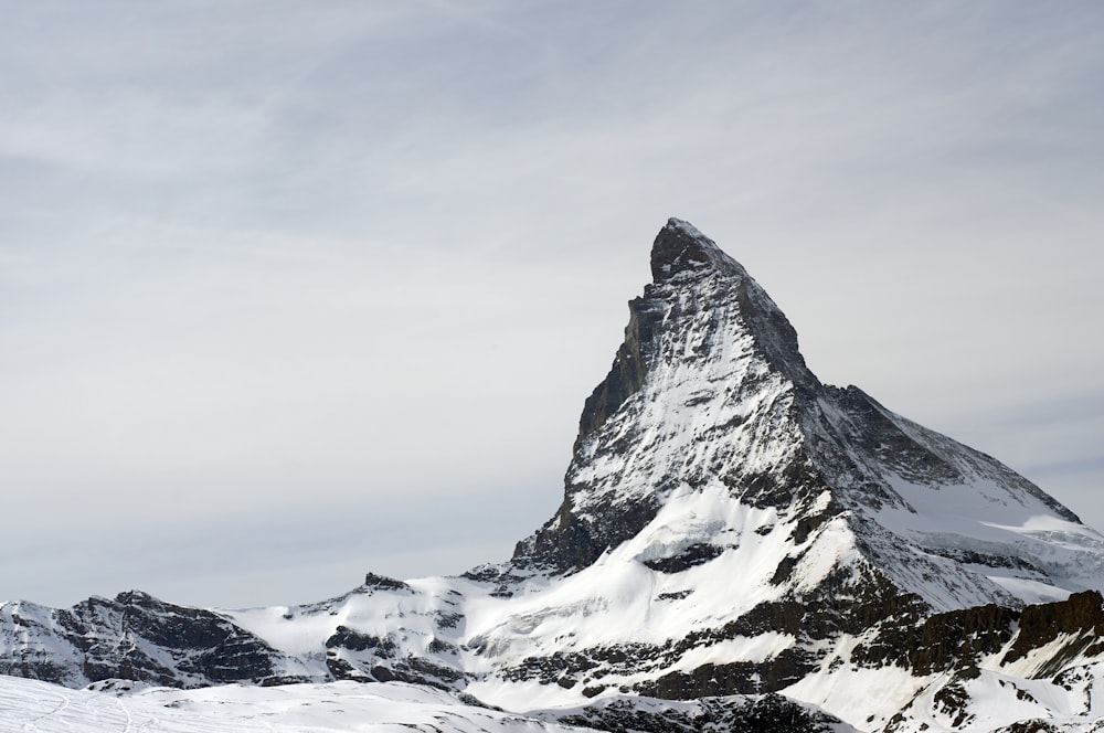 mountain and field covered with snow