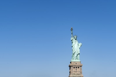 The Liberty Bell framed against a clear blue sky, symbolizing freedom and democratic renewal.