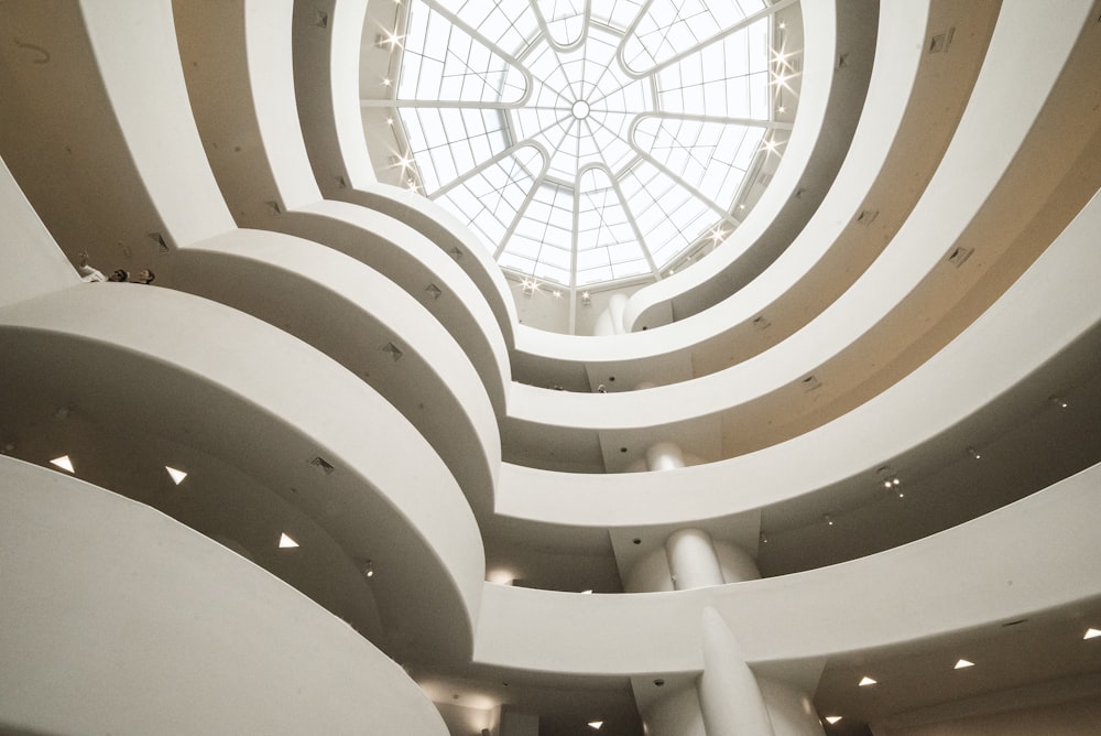 low-angle photography of white concrete building