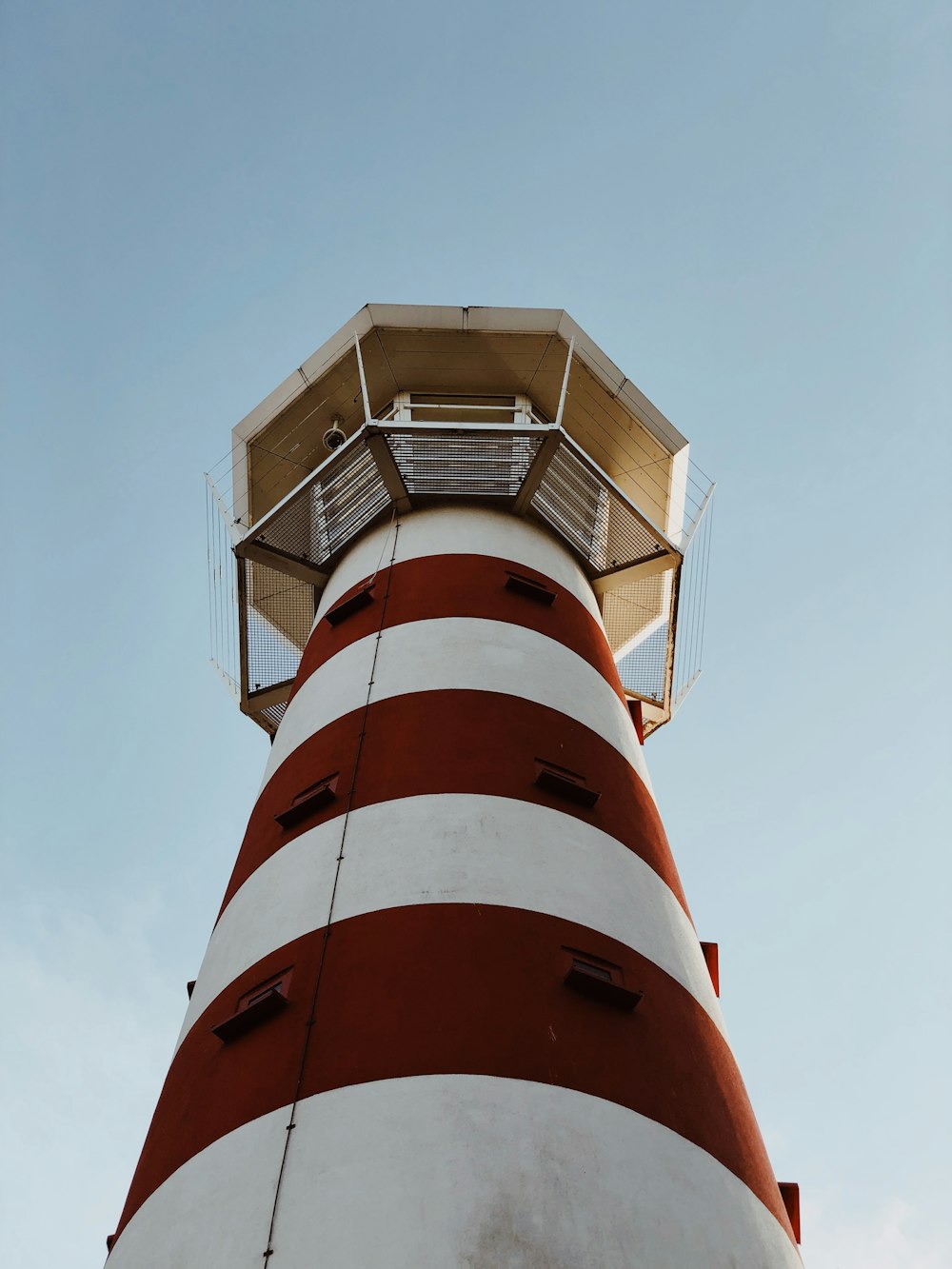 white and red striped concrete lighthouse