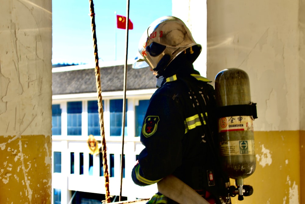 fireman using brown rope during daytime