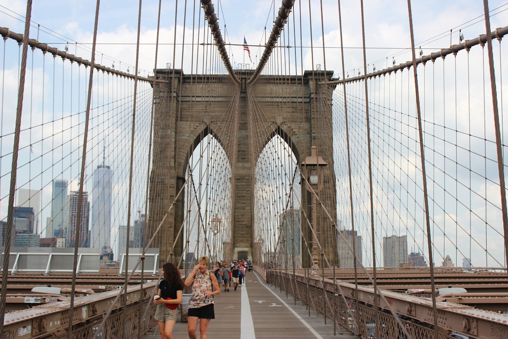 people walking on bridge