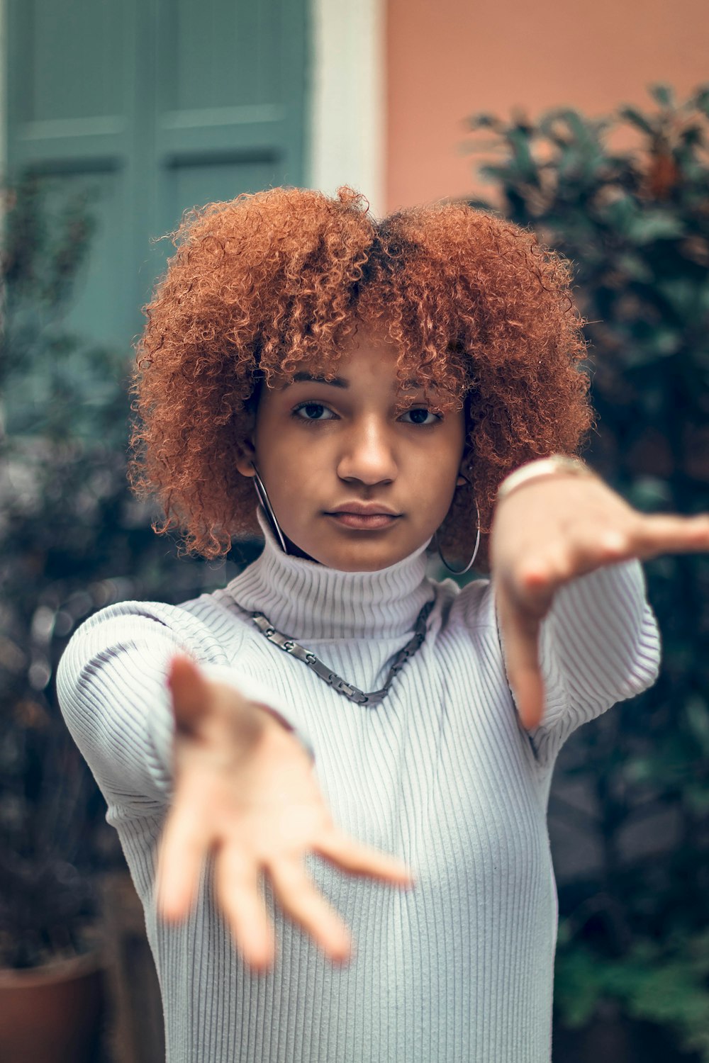 woman wearing white sweater