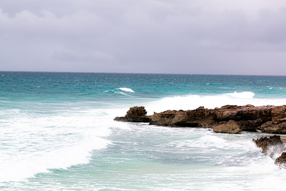 waves crashing on coastal rocks