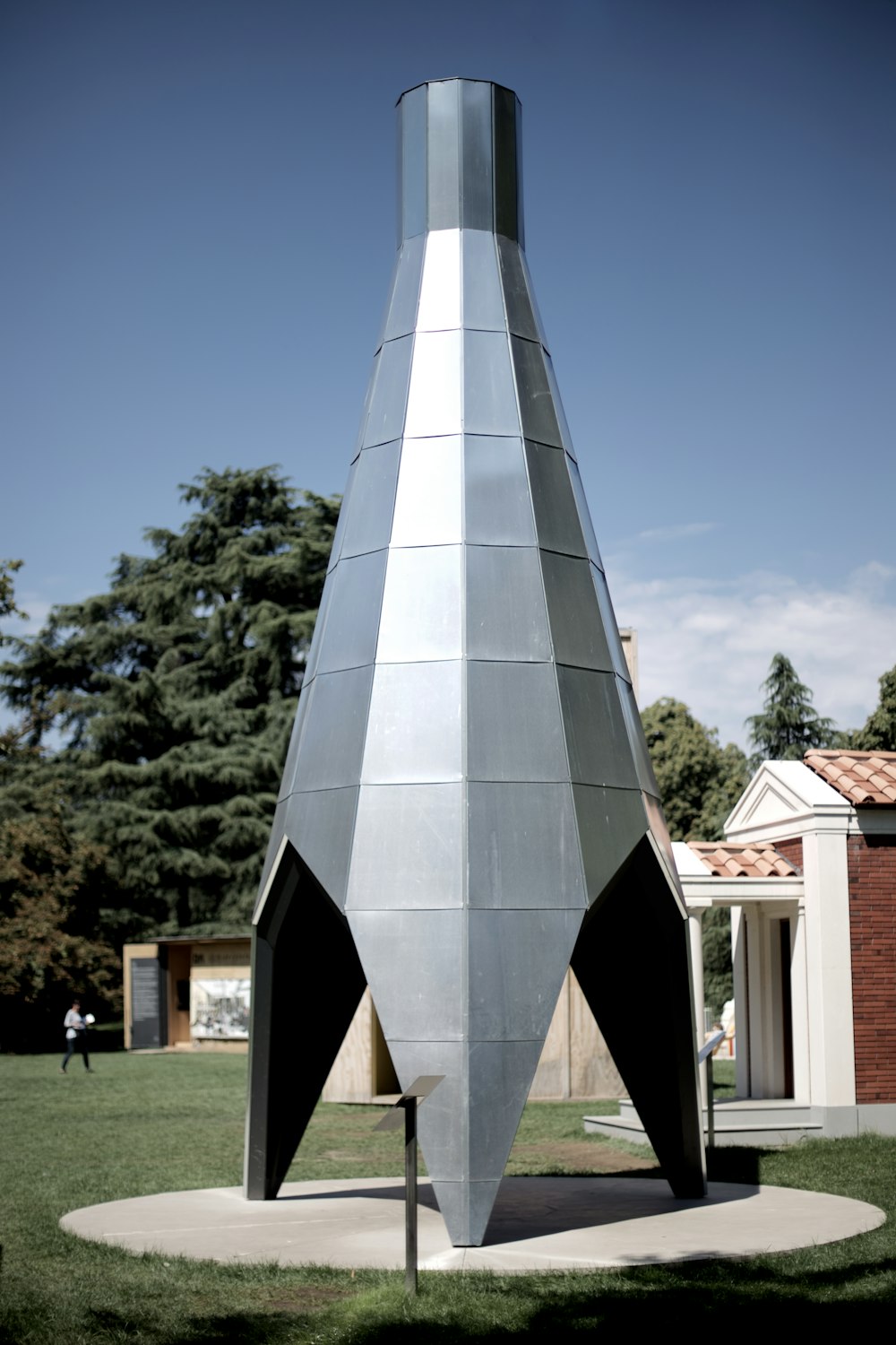 gray metal statue beside building