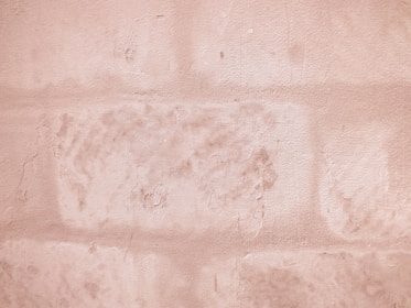 Close-up of a textured decorative wall finish in warm beige tones.