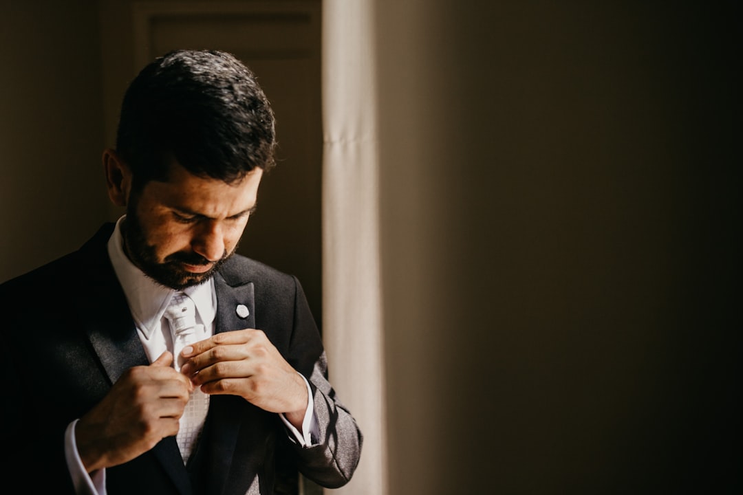 man wearing black suit