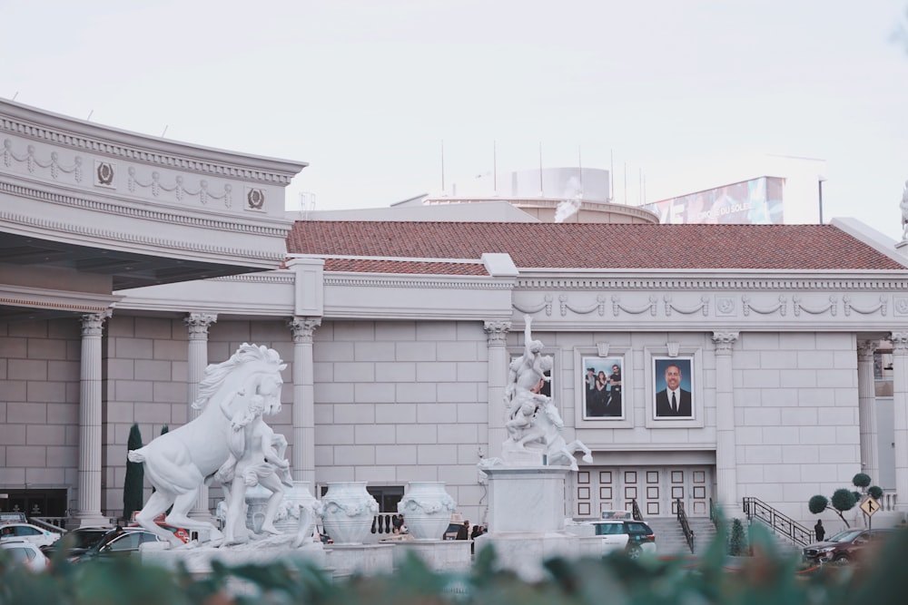 statues in front of building