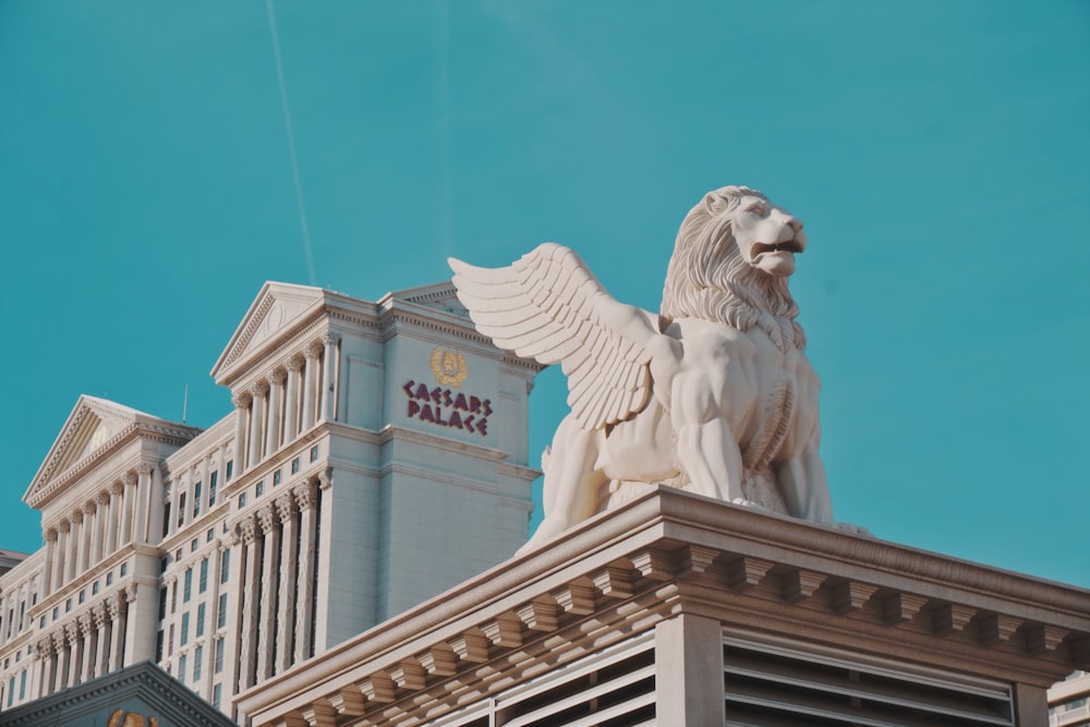 gray concrete winged lion statue