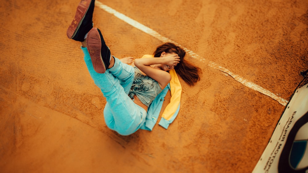 woman lying down on ground