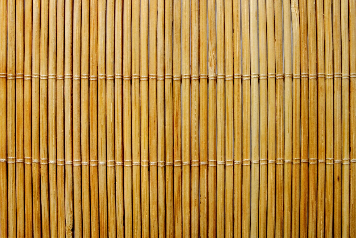 Close-up of a bamboo reed privacy screen showing the natural texture and tight weave of the material