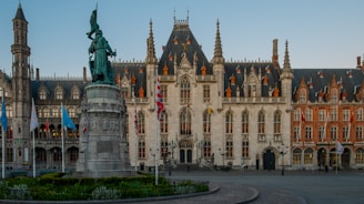 a large building with a statue in front of it