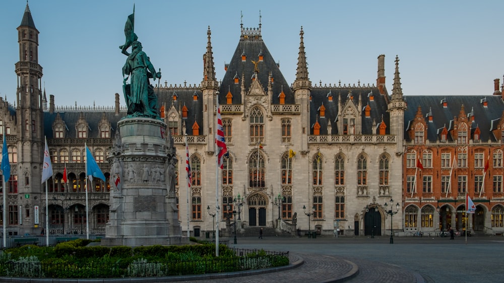 a large building with a statue in front of it