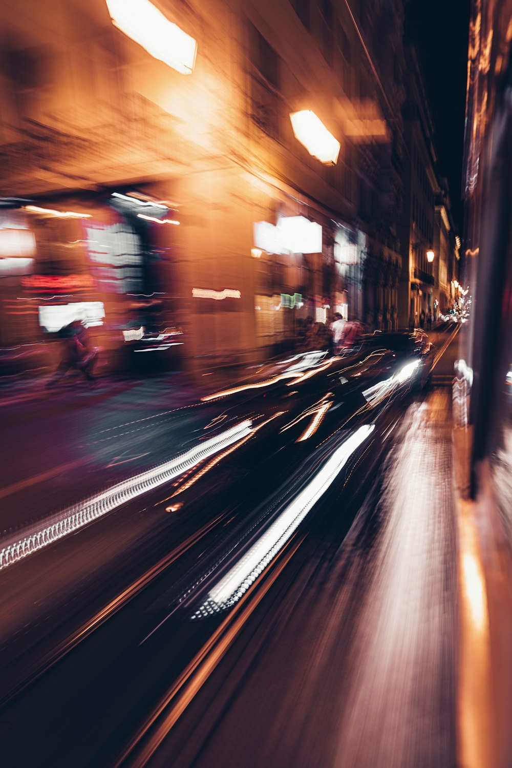 a blurry photo of a city street at night