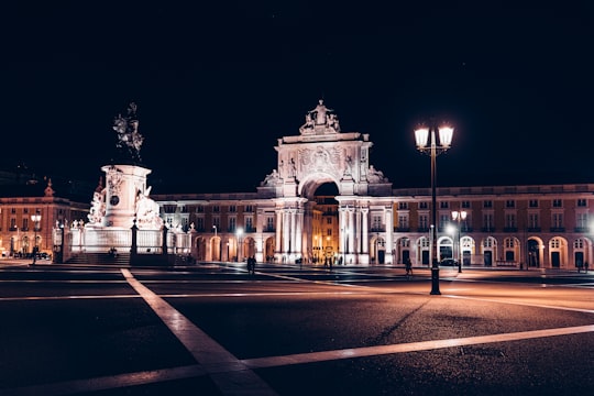 castle with lights in Praça do Comércio Portugal