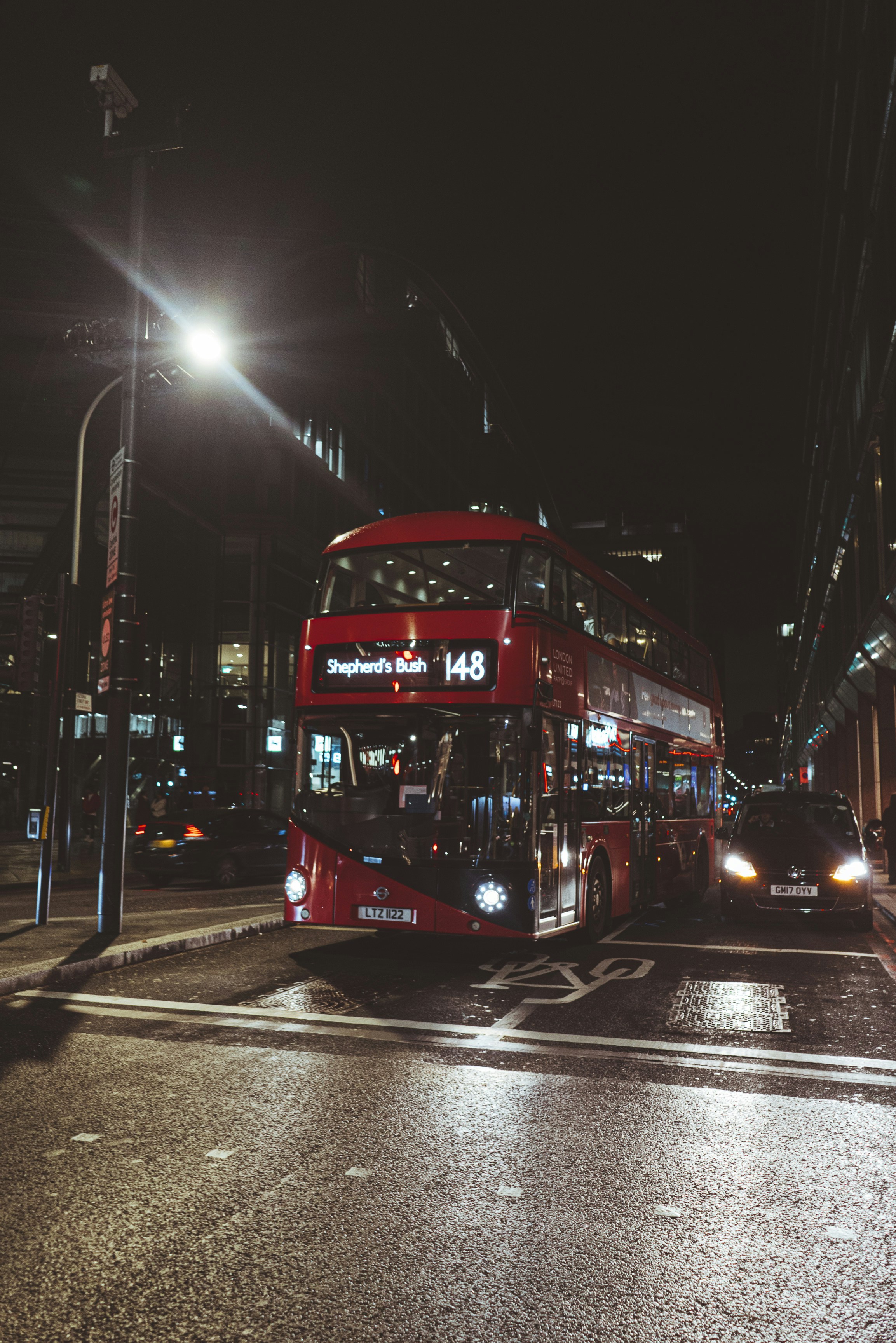 red bus on road