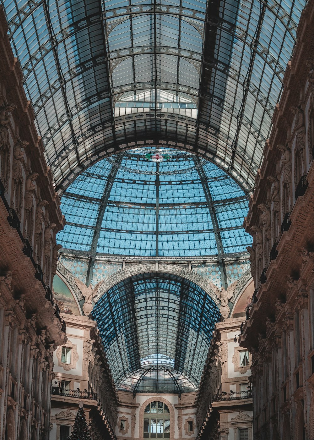 the inside of a building with a glass ceiling