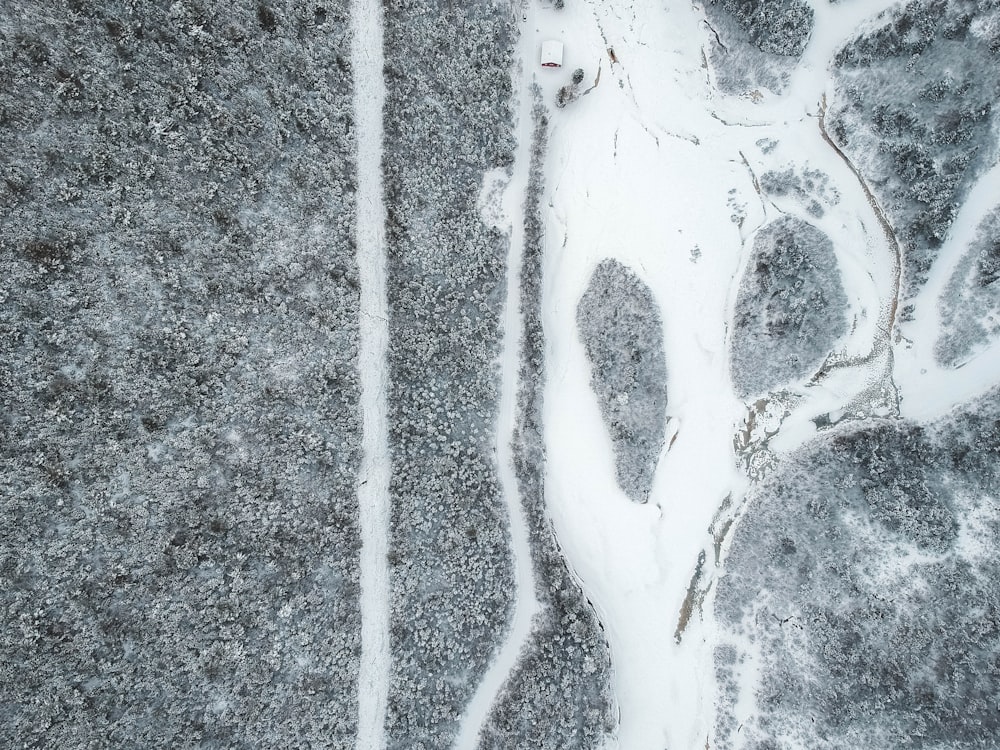 an aerial view of a snow covered field