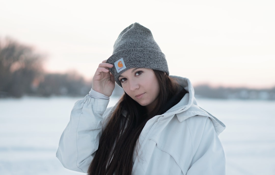 selective focus photography of woman wearing gray Carhartt knit cap