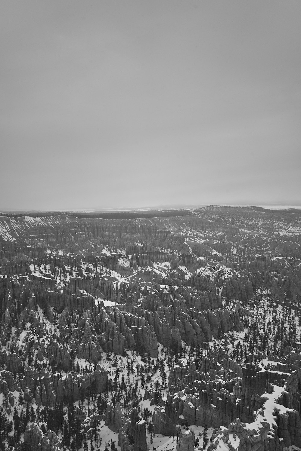 grayscale photography of rock formations