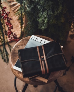 black leather bag on stool