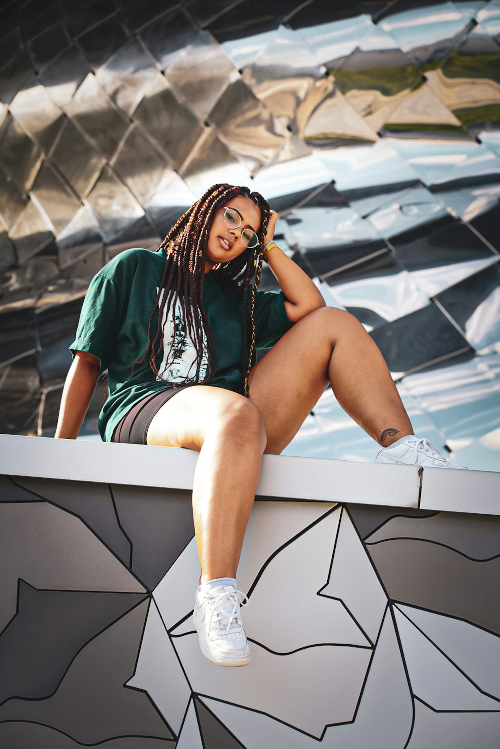 woman sitting on wall