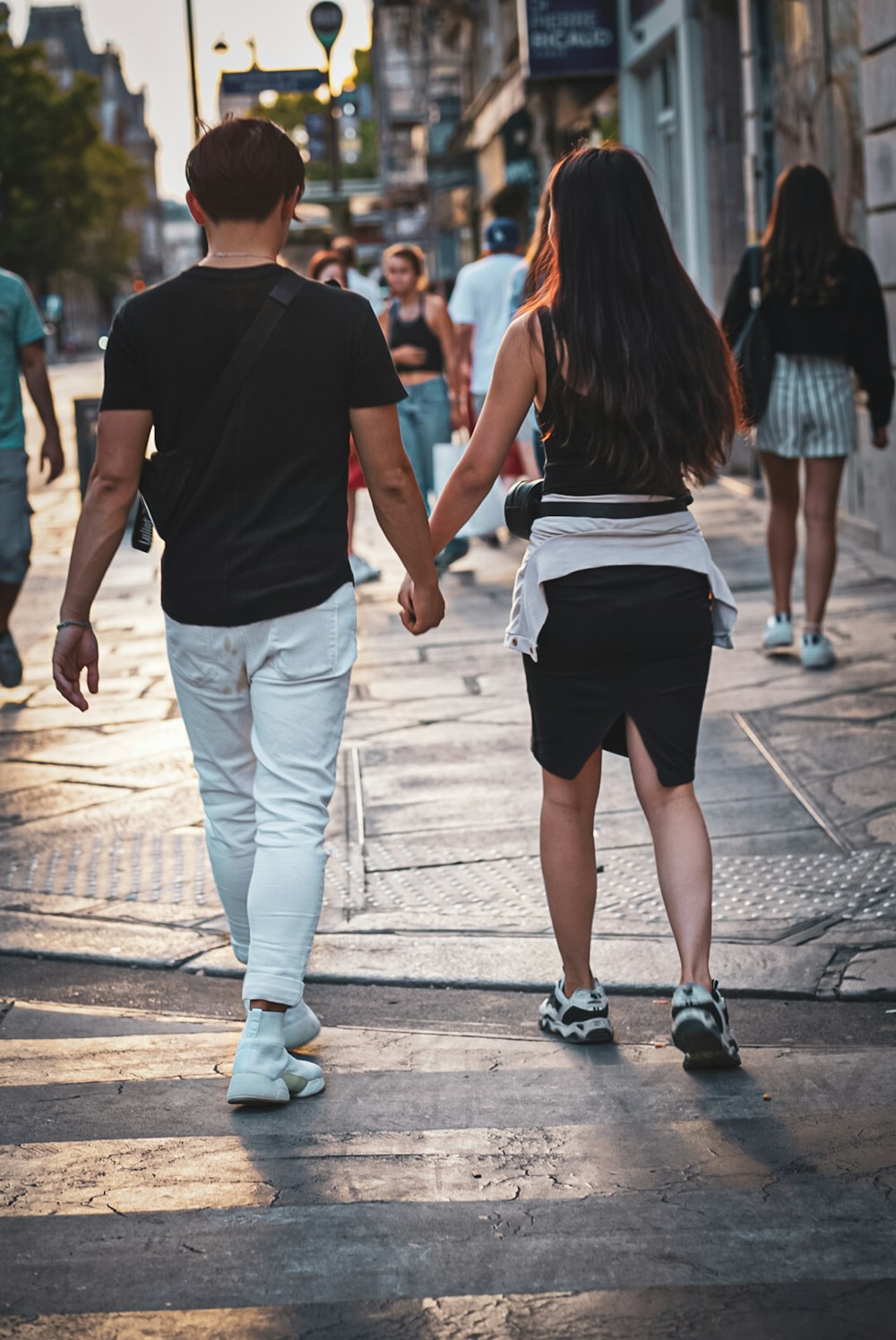 couple walking on pedestrian lane