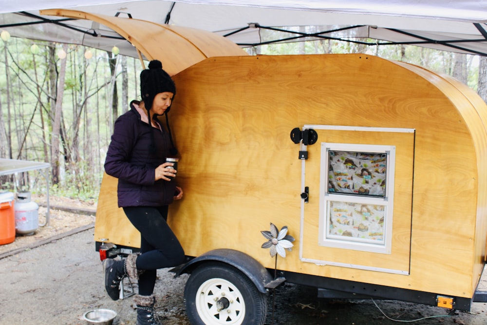 woman near trailer camper