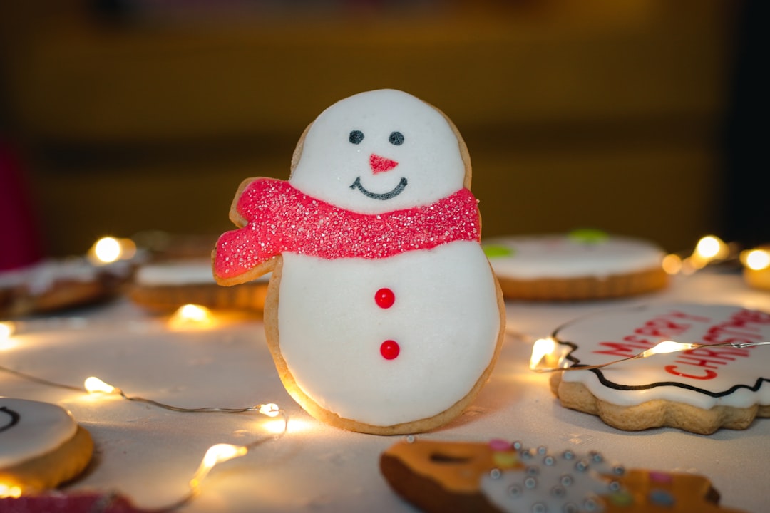 snowman table decor, Christmas cookies in a warm living room.