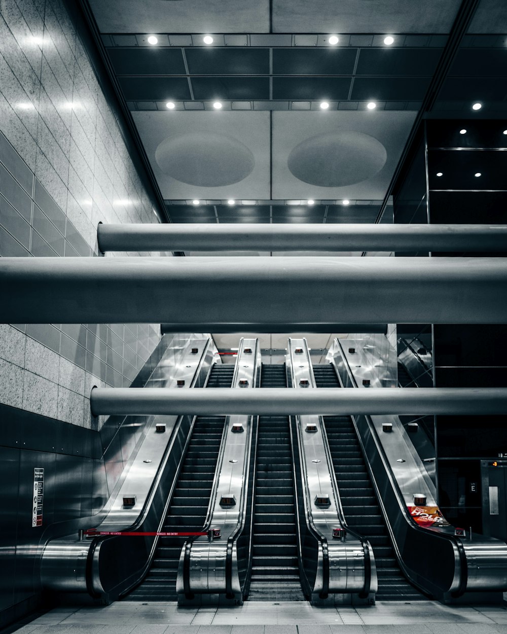 three escalators inside building