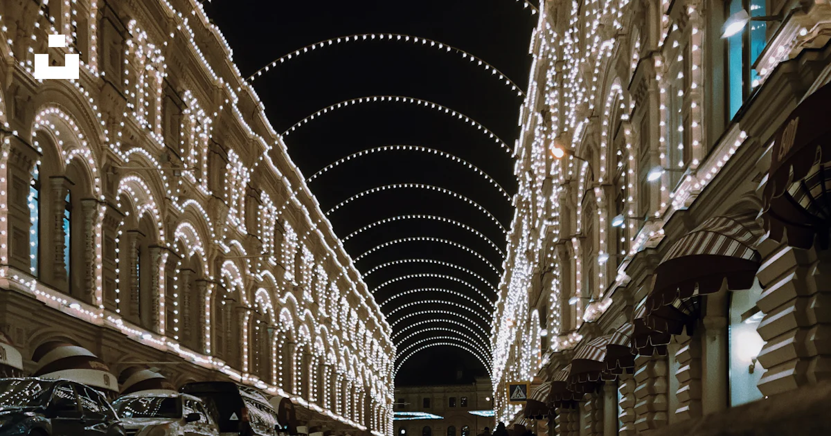Building With String Buildings with string lights during night photo – Free Person Image on ...