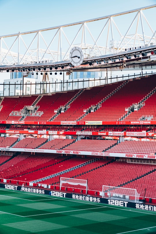 soccer stadium under white and blue sky in Emirates Stadium United Kingdom