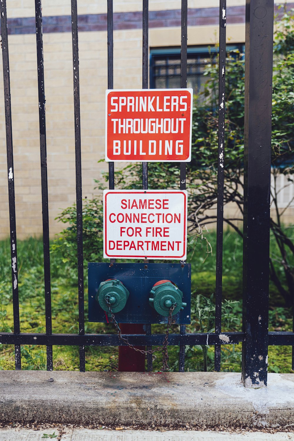 sprinklers throughout building fence sign