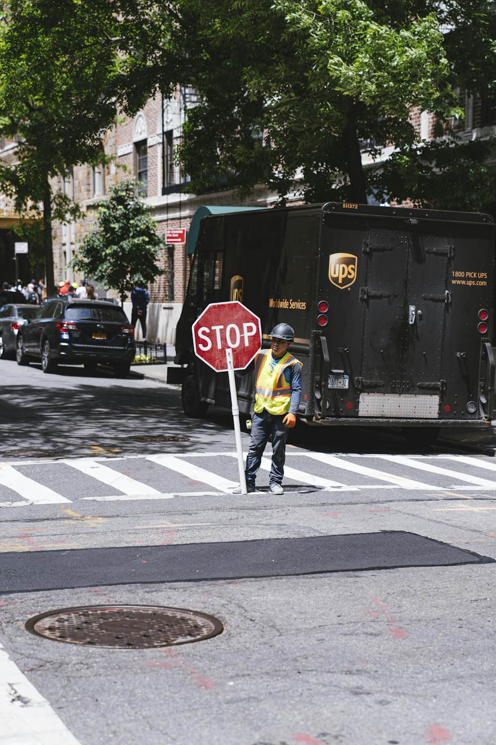 man holding stop street signage