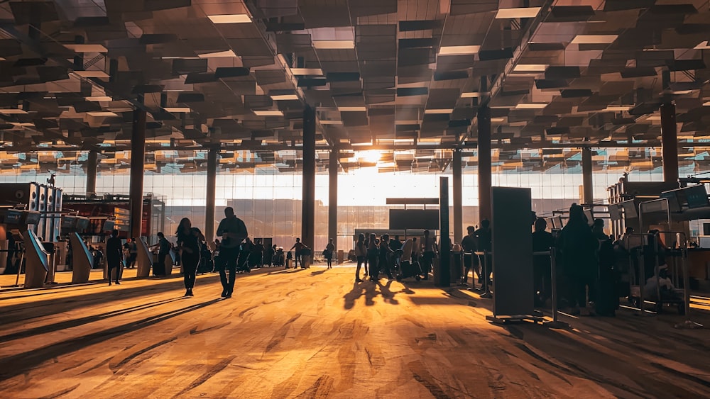 a group of people standing in a large room