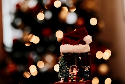 A cozy corner with holiday-themed decorations and a cheerful Santa hat on display.