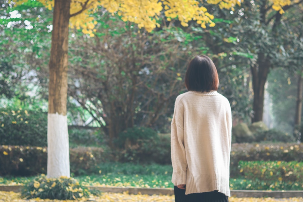 woman looking at trees