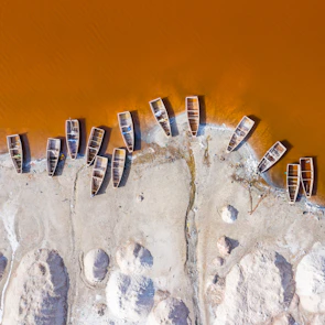 boats dock on sand