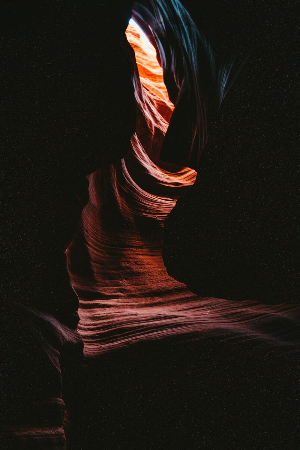 the light is shining on the rock formations