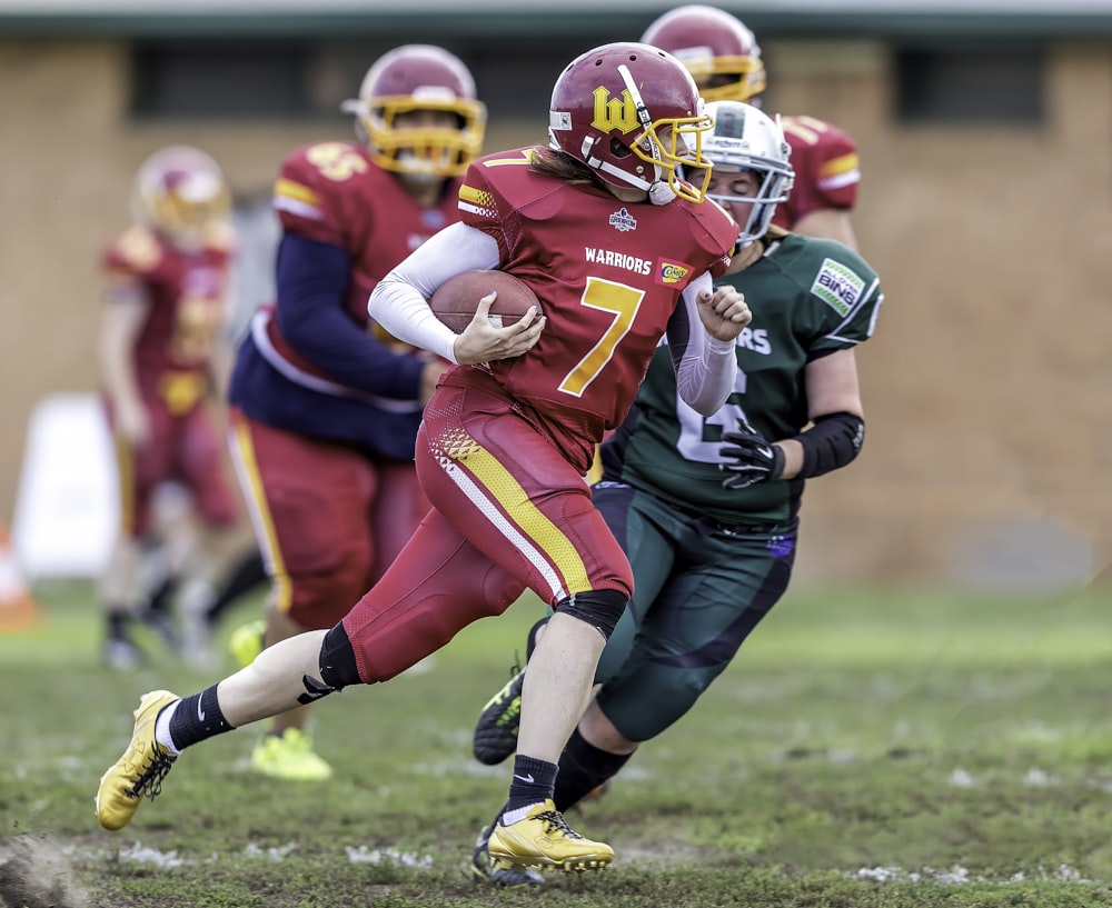 football players running on field