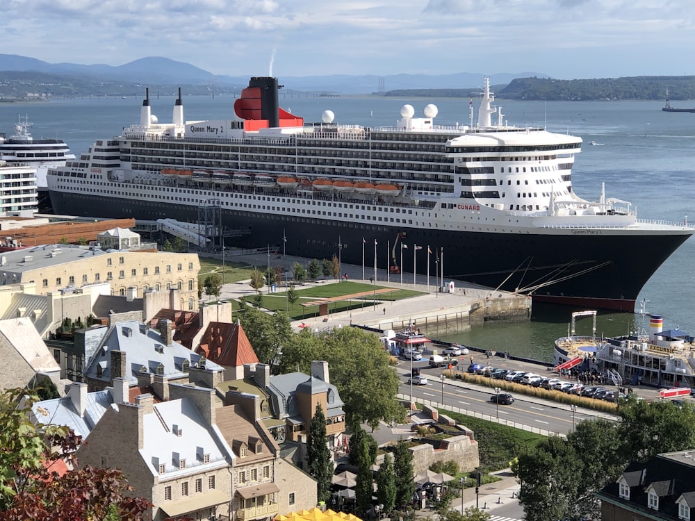 white cruise ship on body of water during daytime