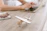 A focused student pilot studying flight manuals at a cozy desk with a model airplane nearby.