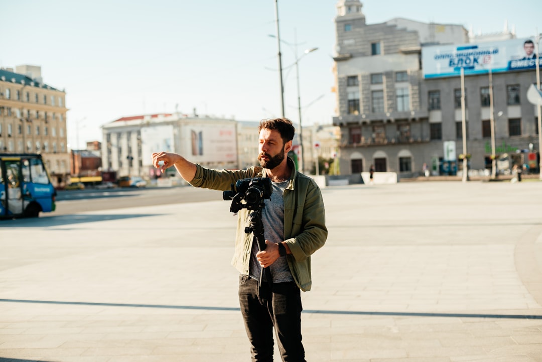 man pointing near buildings