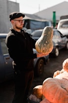 Farmers carefully inspecting fresh produce in early morning light.