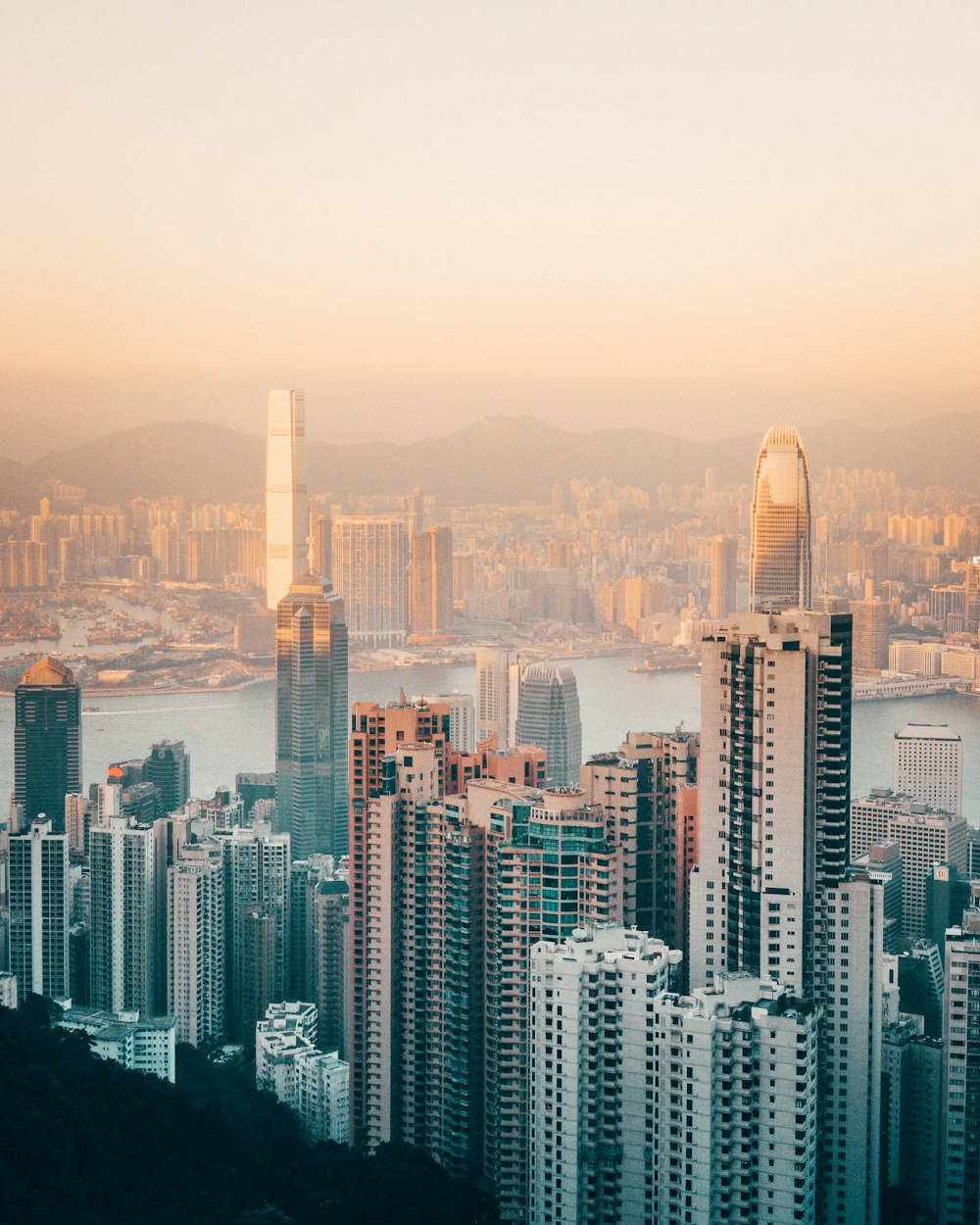 grey high-rise buildings under beige sky