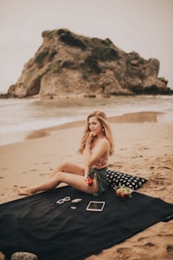 woman sitting on black mat