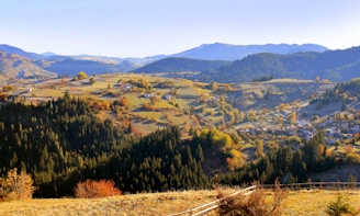 Scenic panorama of the Auvergne-Rhône-Alpes countryside with rolling hills and autumn colors.